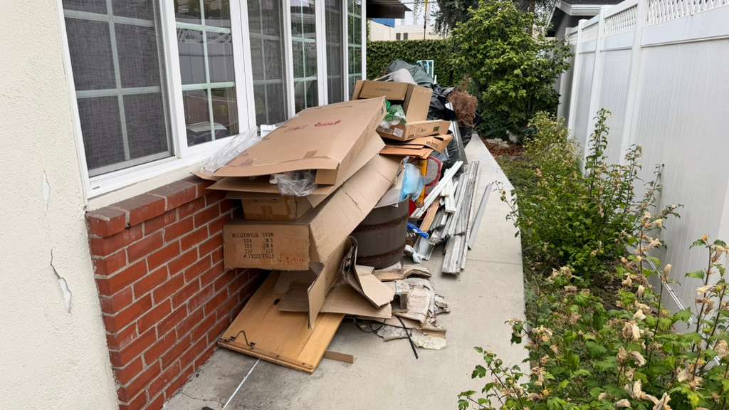 Los Angeles home interior packed with vintage furniture and belongings before estate cleanout